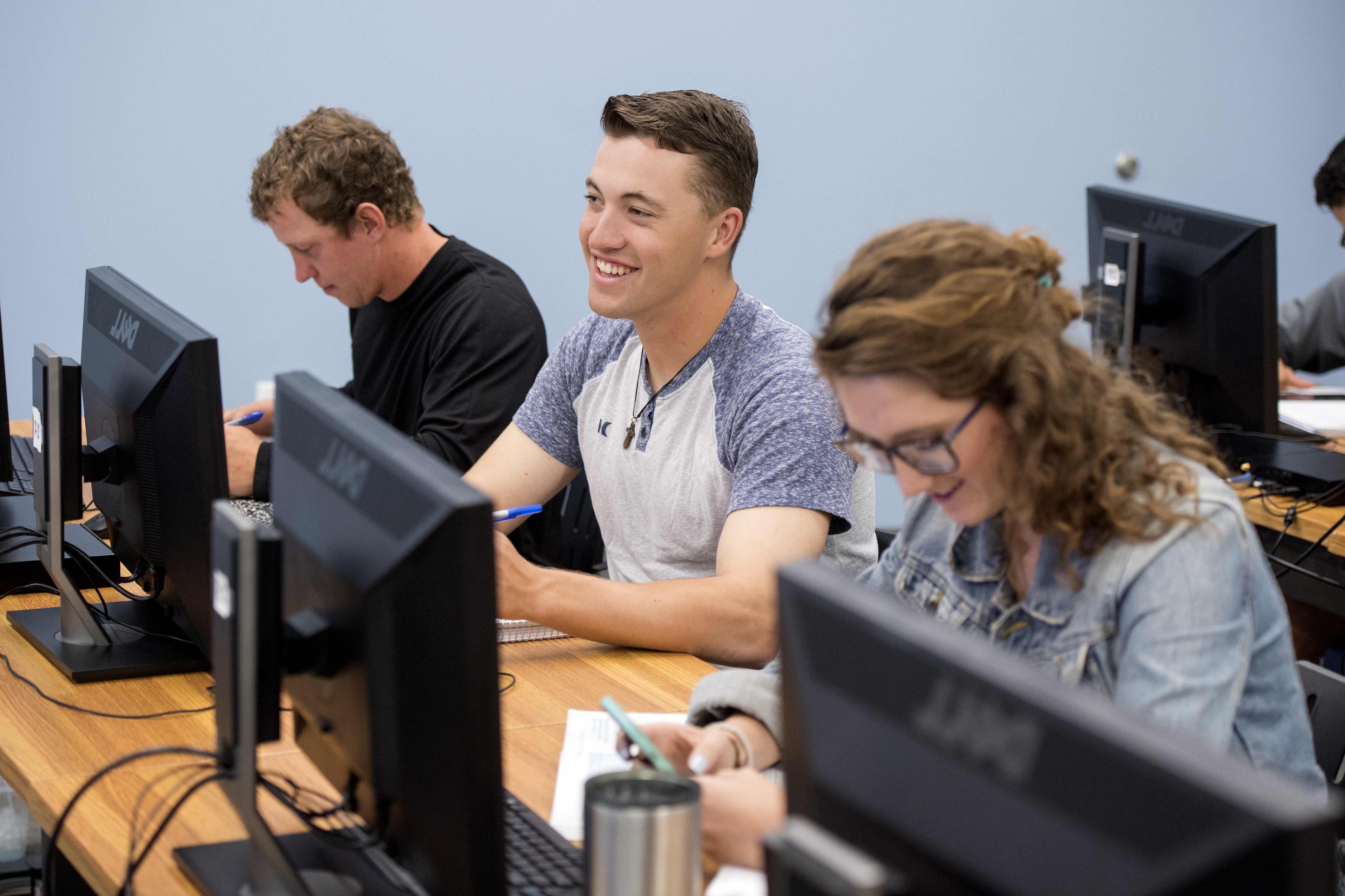 Smiling student in computer class